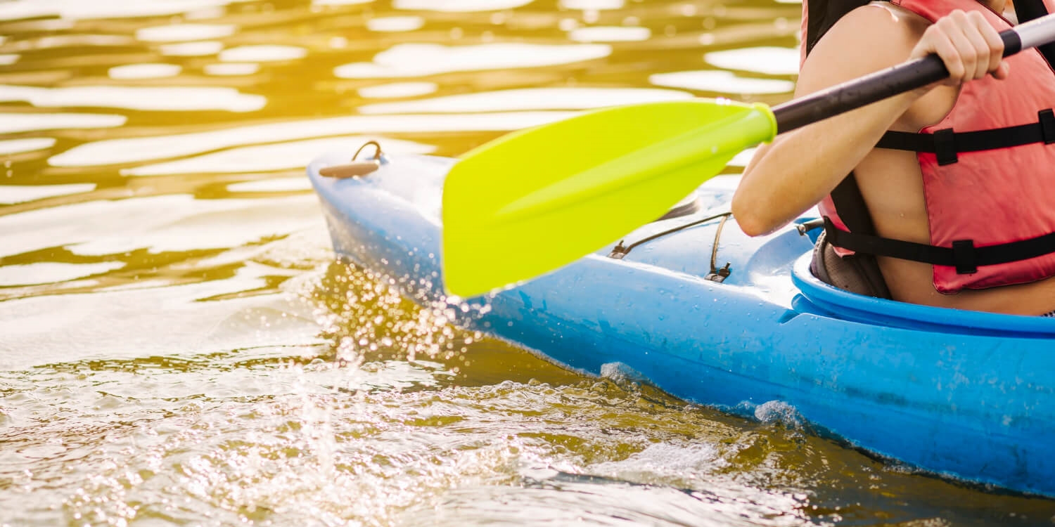 male-kayaking-with-paddle-on-lake (1)